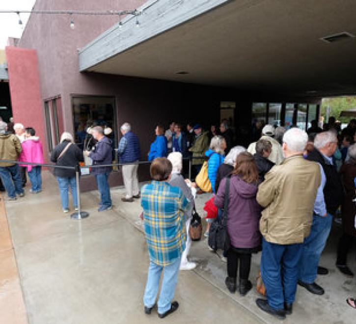 crowd enters theater